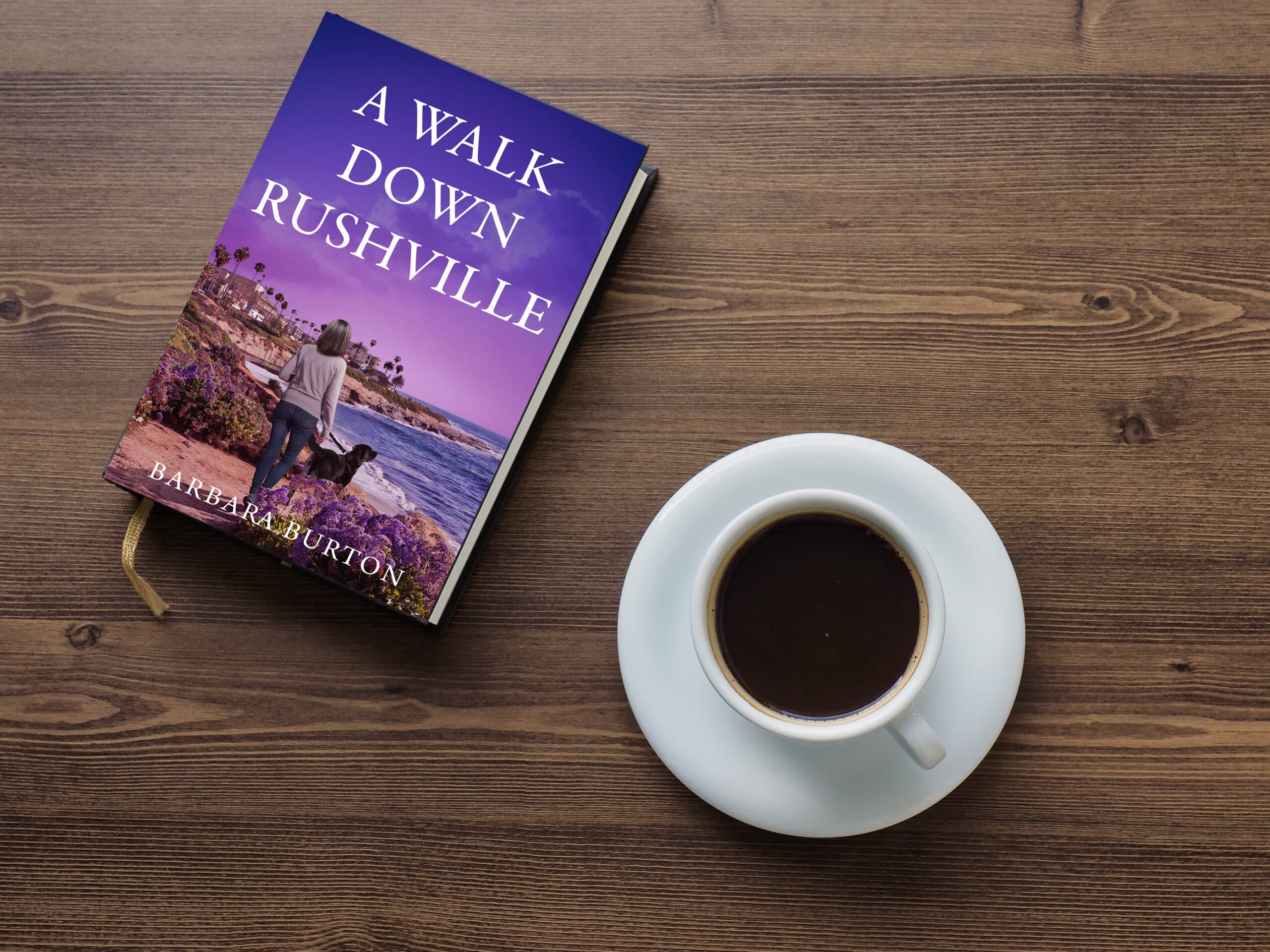 A Walk Down Rushville on a table beside a cup of coffee